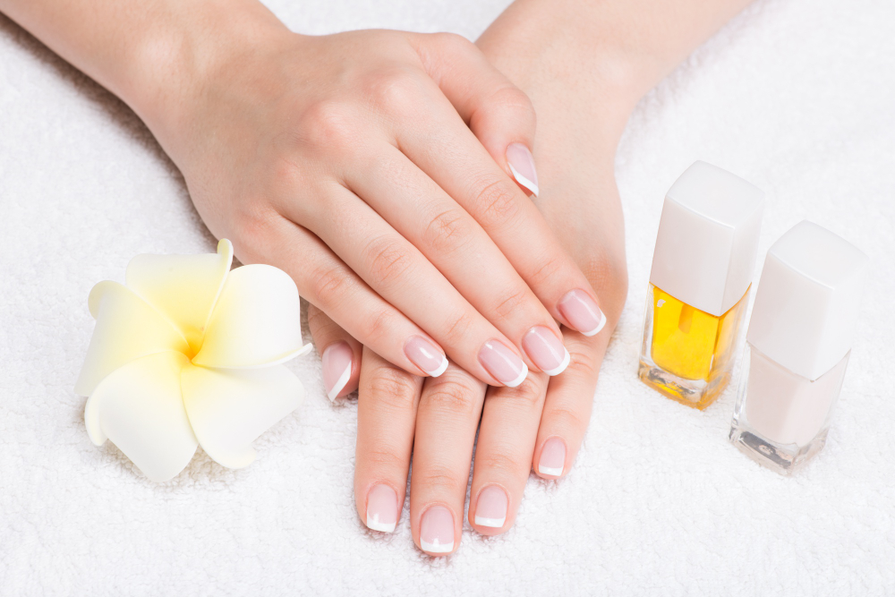 woman-nail-salon-receiving-manicure-by-beautician-beauty-treatment-concept.jpg